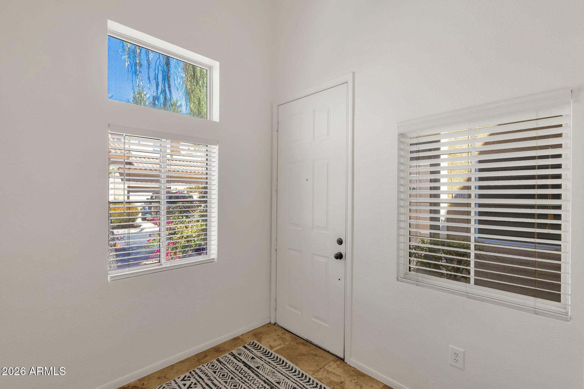 8245 East Bell Road, Unit 208 Scottsdale, AZ 85260 - Photo 15 of 48 a view of an empty room with a window