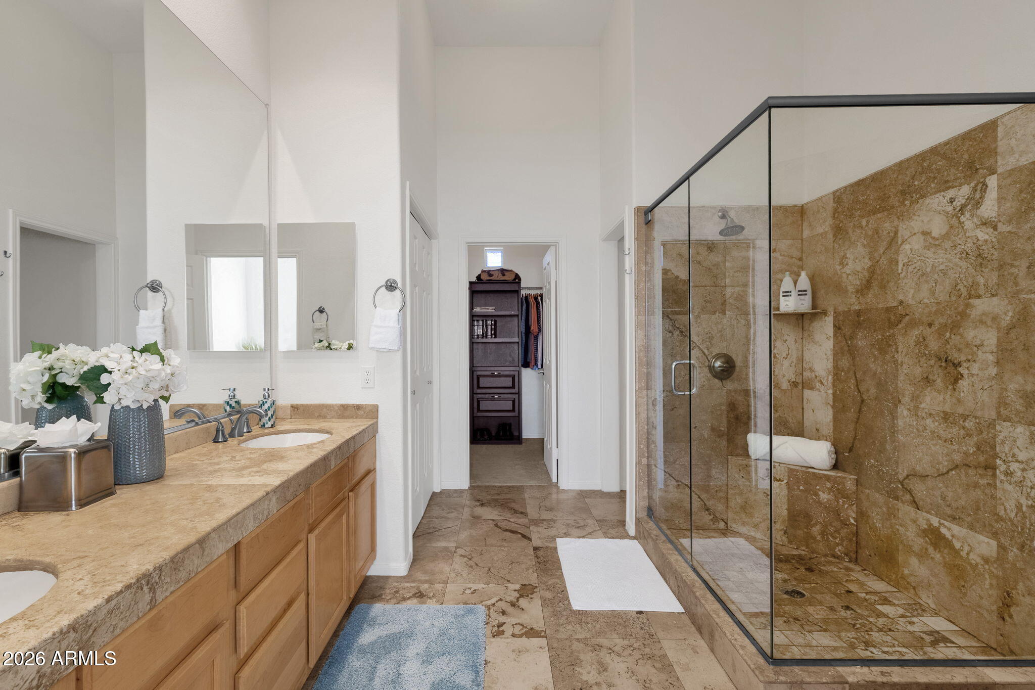 8245 East Bell Road, Unit 208 Scottsdale, AZ 85260 - Photo 32 of 48 a bathroom with a granite countertop sink mirror and shower