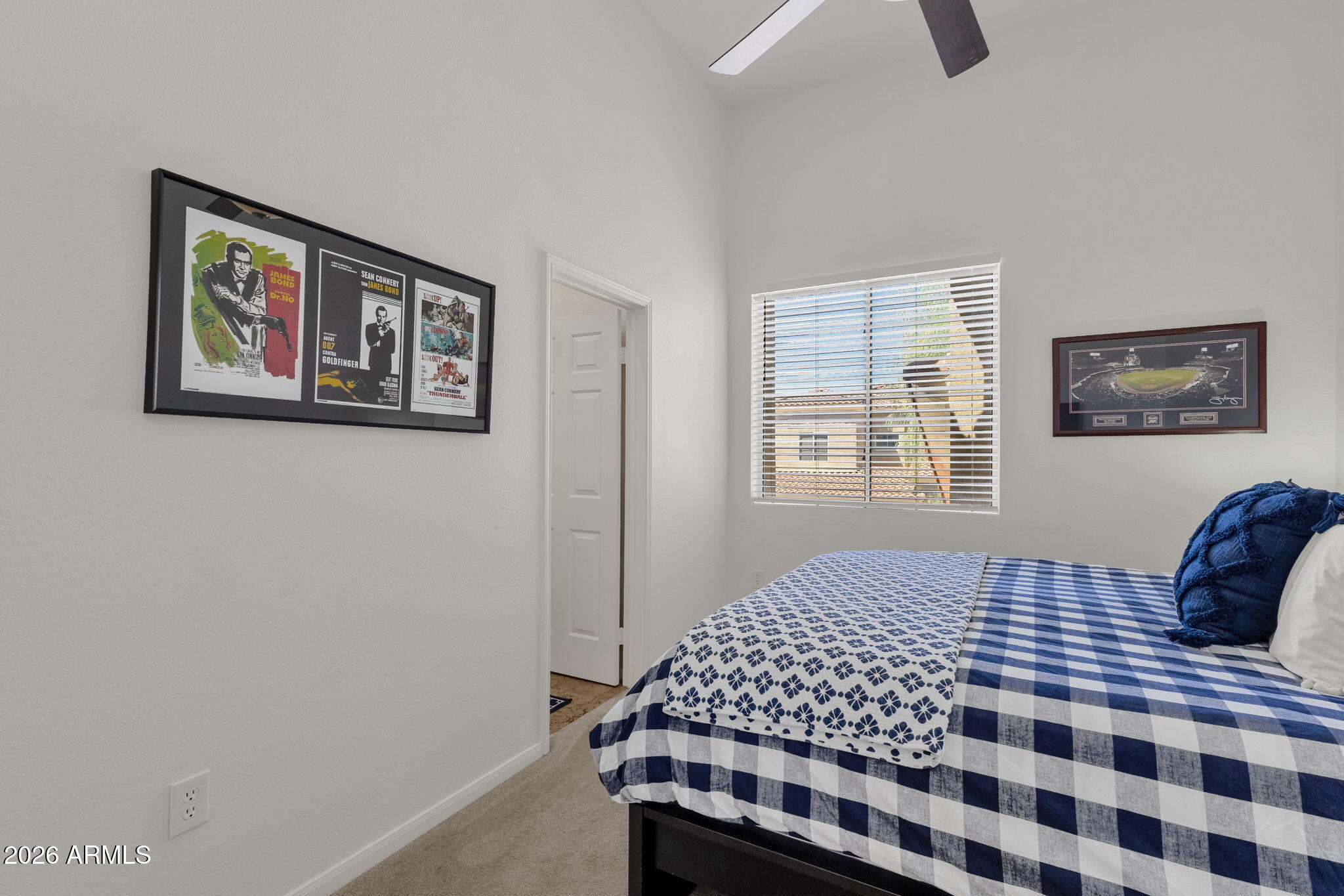 8245 East Bell Road, Unit 208 Scottsdale, AZ 85260 - Photo 36 of 48 a bedroom with a bed and a window