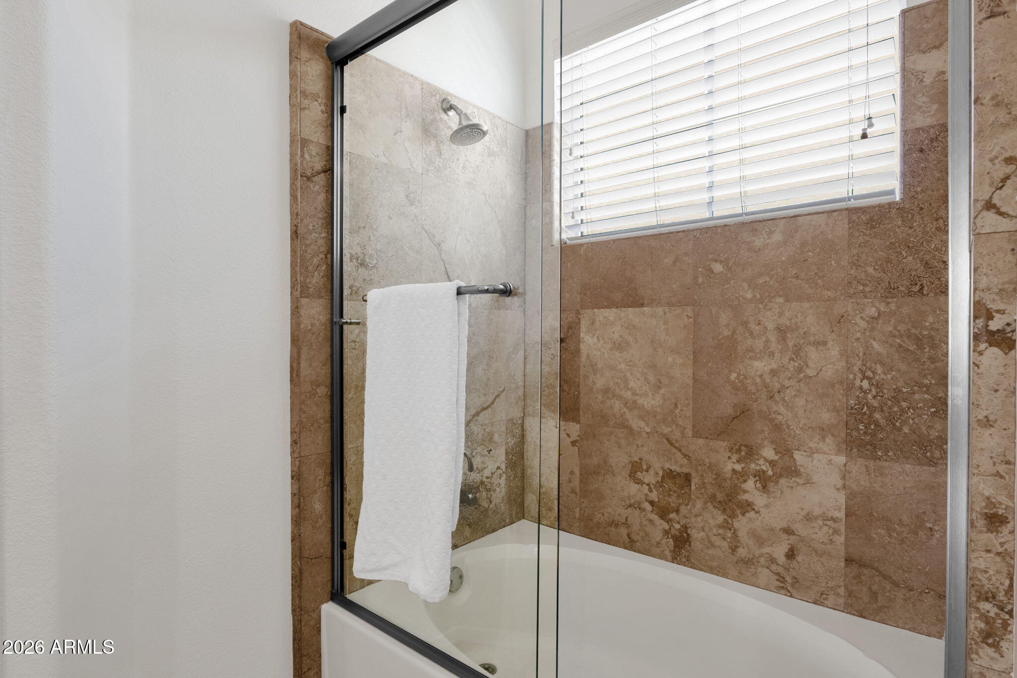 8245 East Bell Road, Unit 208 Scottsdale, AZ 85260 - Photo 38 of 48 a bathroom with a bathtub and a shower