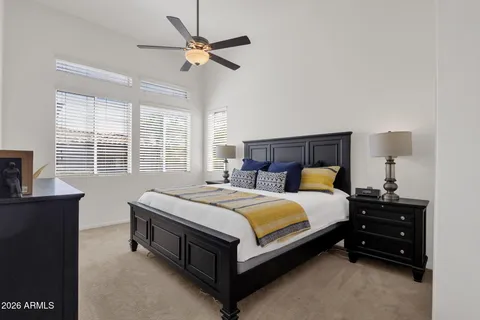 a bed room with a bed and a chandelier