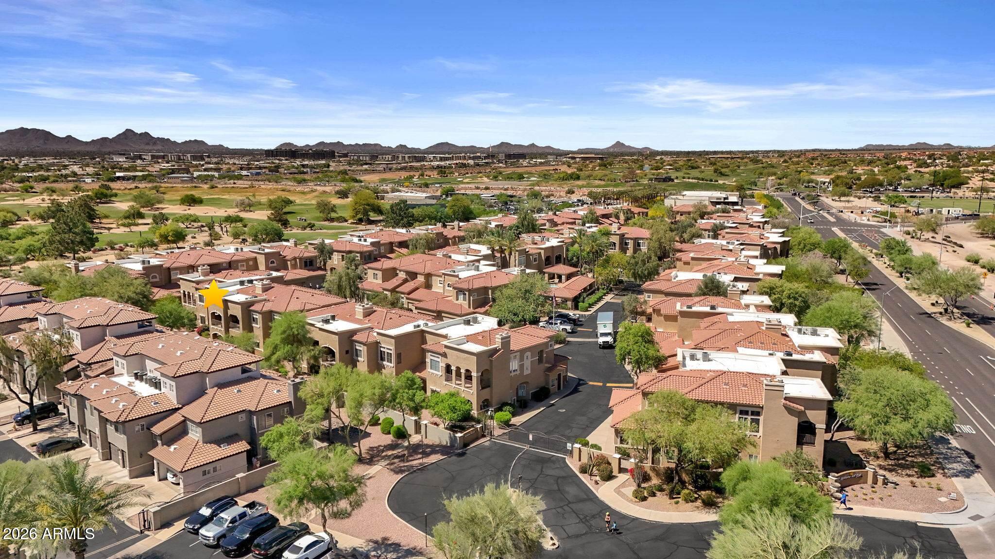 8245 East Bell Road, Unit 208 Scottsdale, AZ 85260 - Photo 8 of 48 an aerial view of residential houses with outdoor space and trees