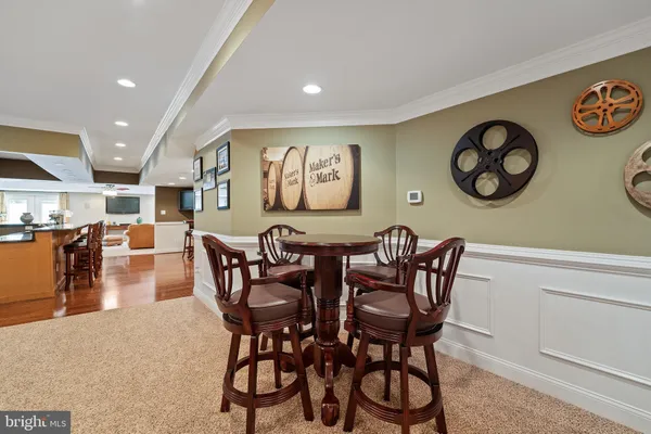 a view of a dining area with furniture and chandelier