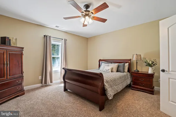 a view of a patio with a table chairs and a swimming pool