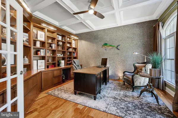 a living room with furniture a lamp and a chandelier