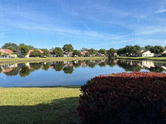 a view of a swimming pool with an outdoor seating