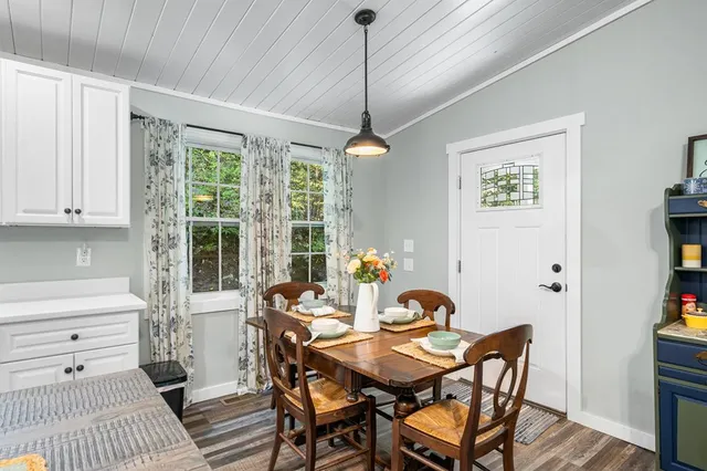 a view of a dining room with furniture window and outside view