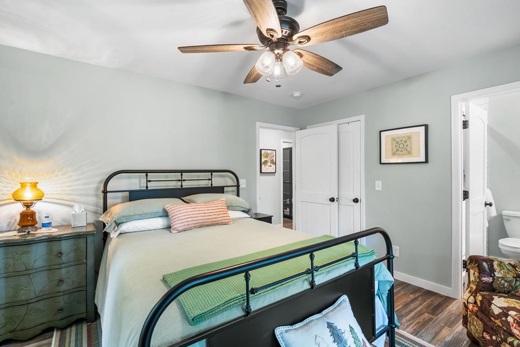 270 Hiawassee River Road Murphy, NC 28906 - Photo 19 of 50 a bedroom with a bed and a chandelier