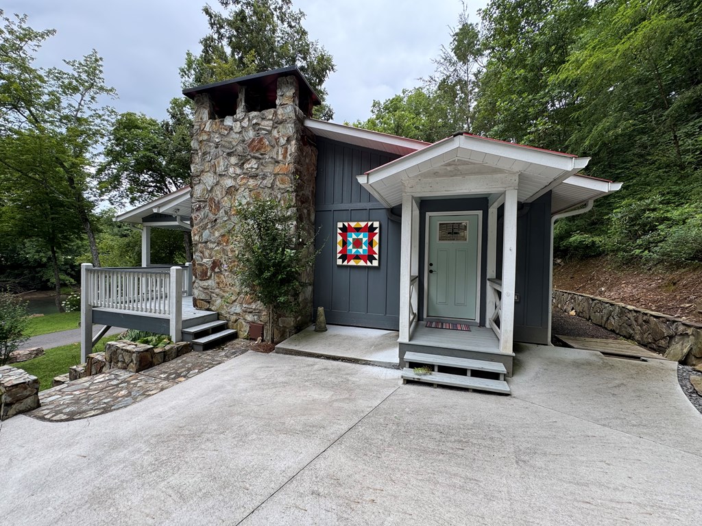 270 Hiawassee River Road Murphy, NC 28906 - Photo 2 of 50 a front view of a house with garden