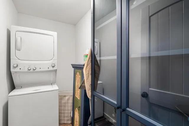 a bathroom with a toilet and a mirror