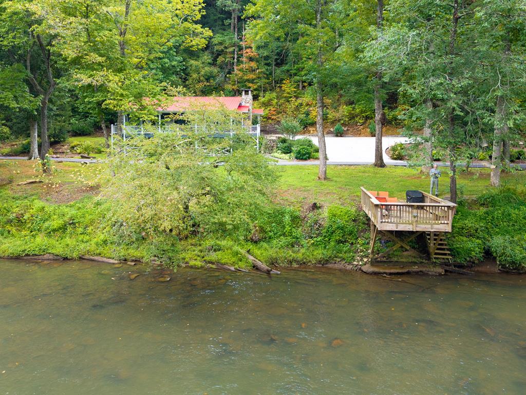 270 Hiawassee River Road Murphy, NC 28906 - Photo 36 of 50 a backyard of a house with yard and outdoor seating