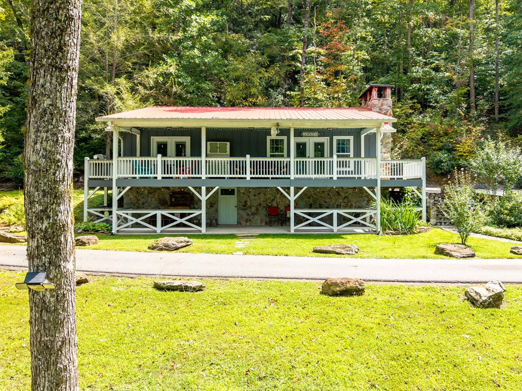 270 Hiawassee River Road Murphy, NC 28906 - Photo 38 of 50 a view of a house with a backyard patio and swimming pool