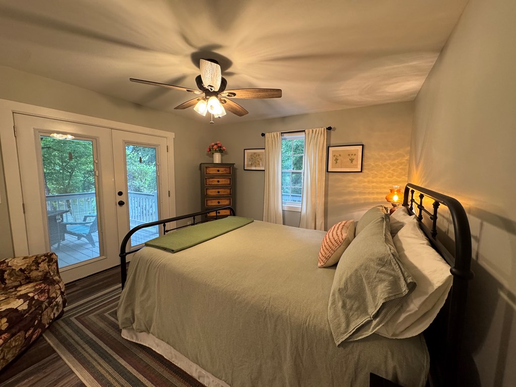 270 Hiawassee River Road Murphy, NC 28906 - Photo 6 of 50 a bedroom with a bed and wooden floor