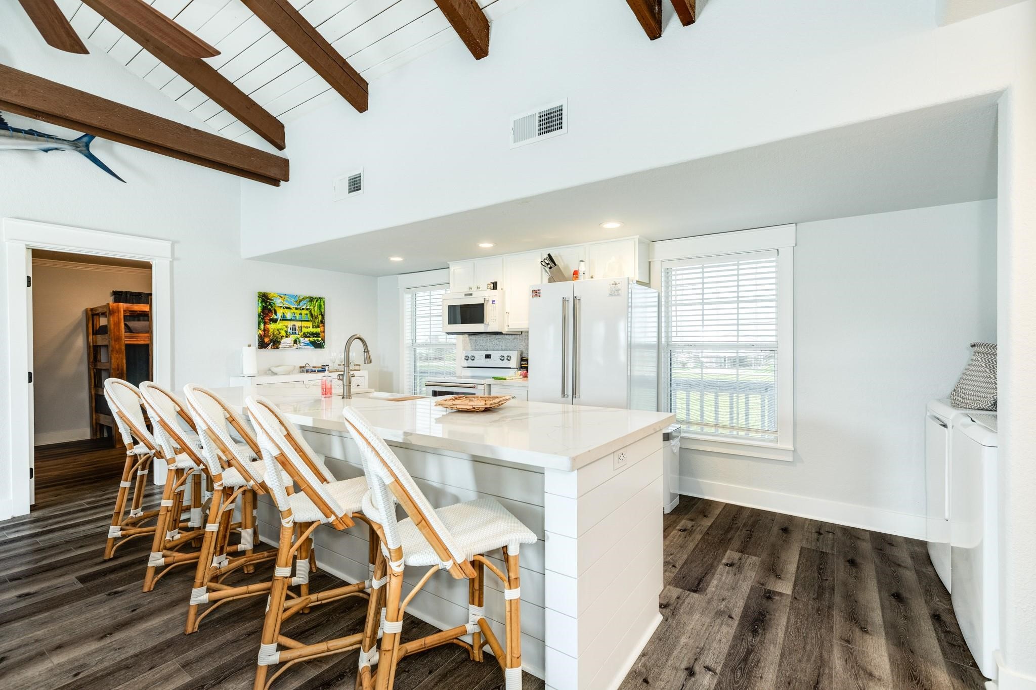 307 Angel Wing Street Surfside Beach, TX 77541 - Photo 7 of 23 a view of a dining room with furniture and a table