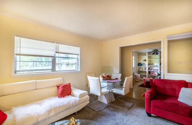 a living room with furniture and a window