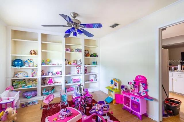 a bedroom with lots of baby toys