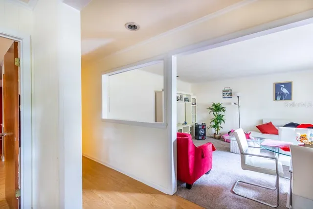 a living room with furniture and flowers