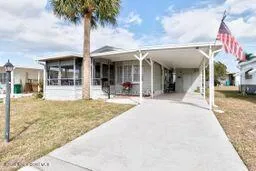 front view of a building with a garden