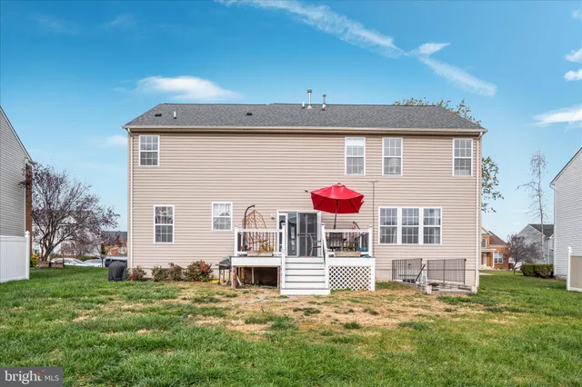 an aerial view of residential houses with outdoor space and swimming pool