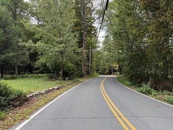 25 Basket Street Huntington, MA 01050 - Photo 7 of 8 a view of a road with a yard