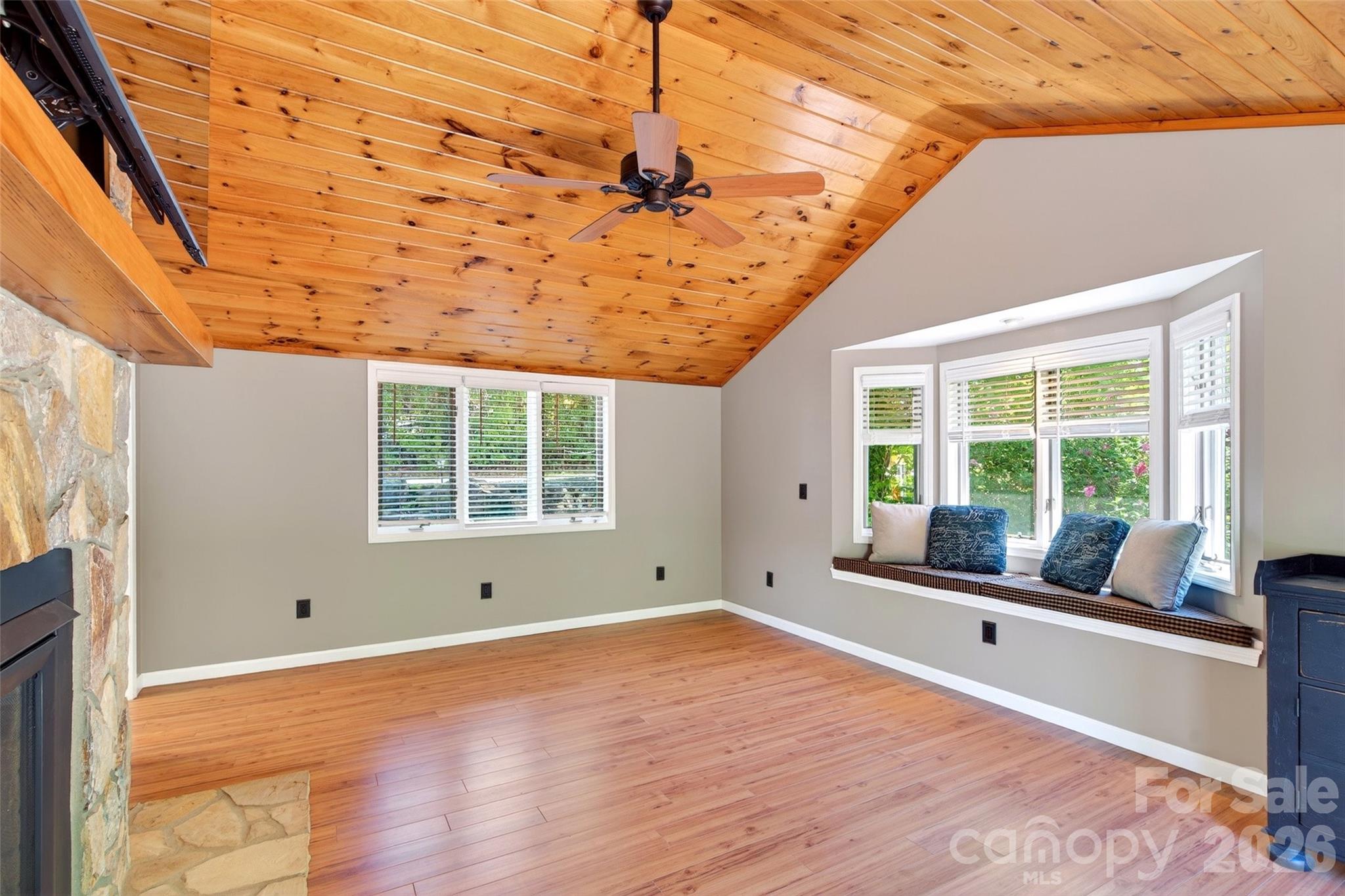 334 Harbor Lake Road Newland, NC 28657 - Photo 12 of 48 a view of a room with wooden floor and windows