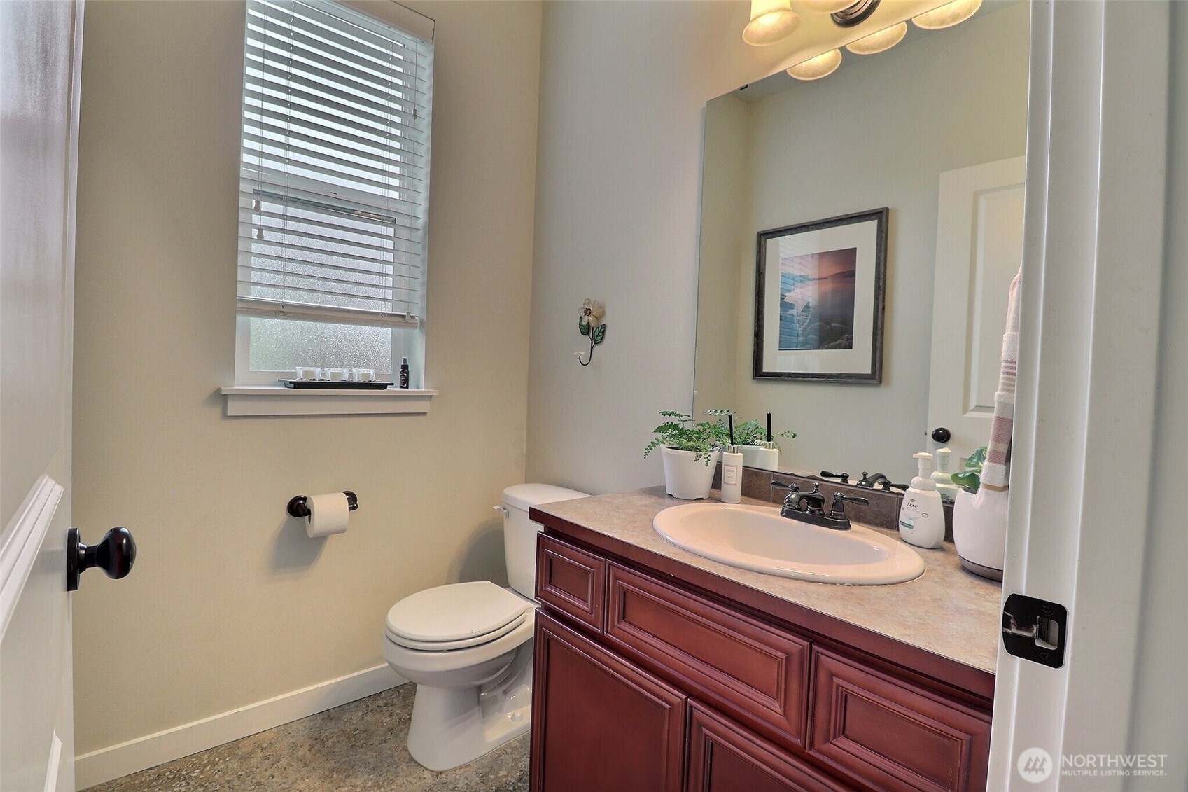 19776 Mountain Ridge Road Southeast Monroe, WA 98272 - Photo 6 of 40 a bathroom with a sink a toilet and mirror