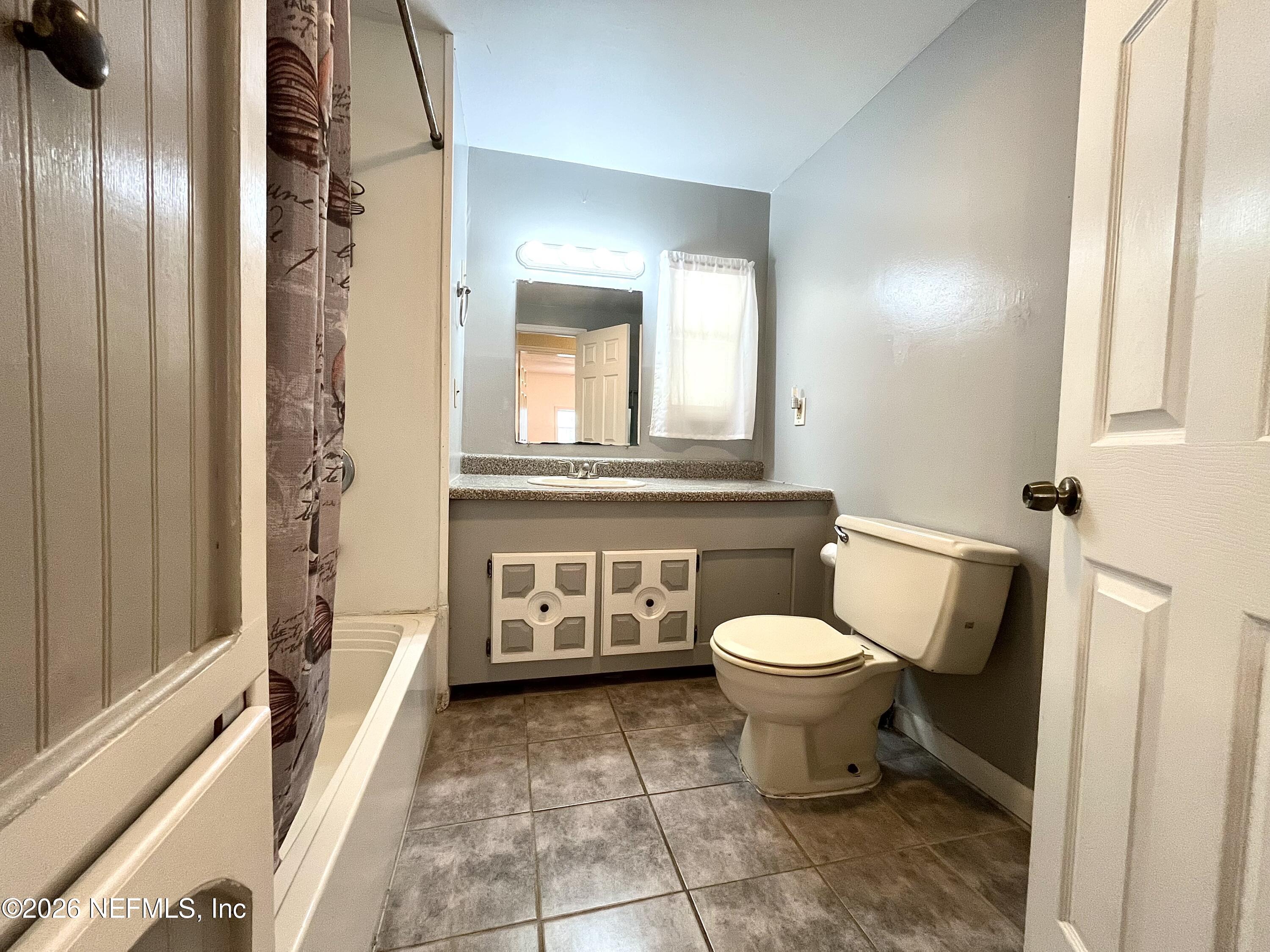 145 Magnolia Trail Satsuma, FL 32189 - Photo 15 of 20 a bathroom with a toilet sink and mirror