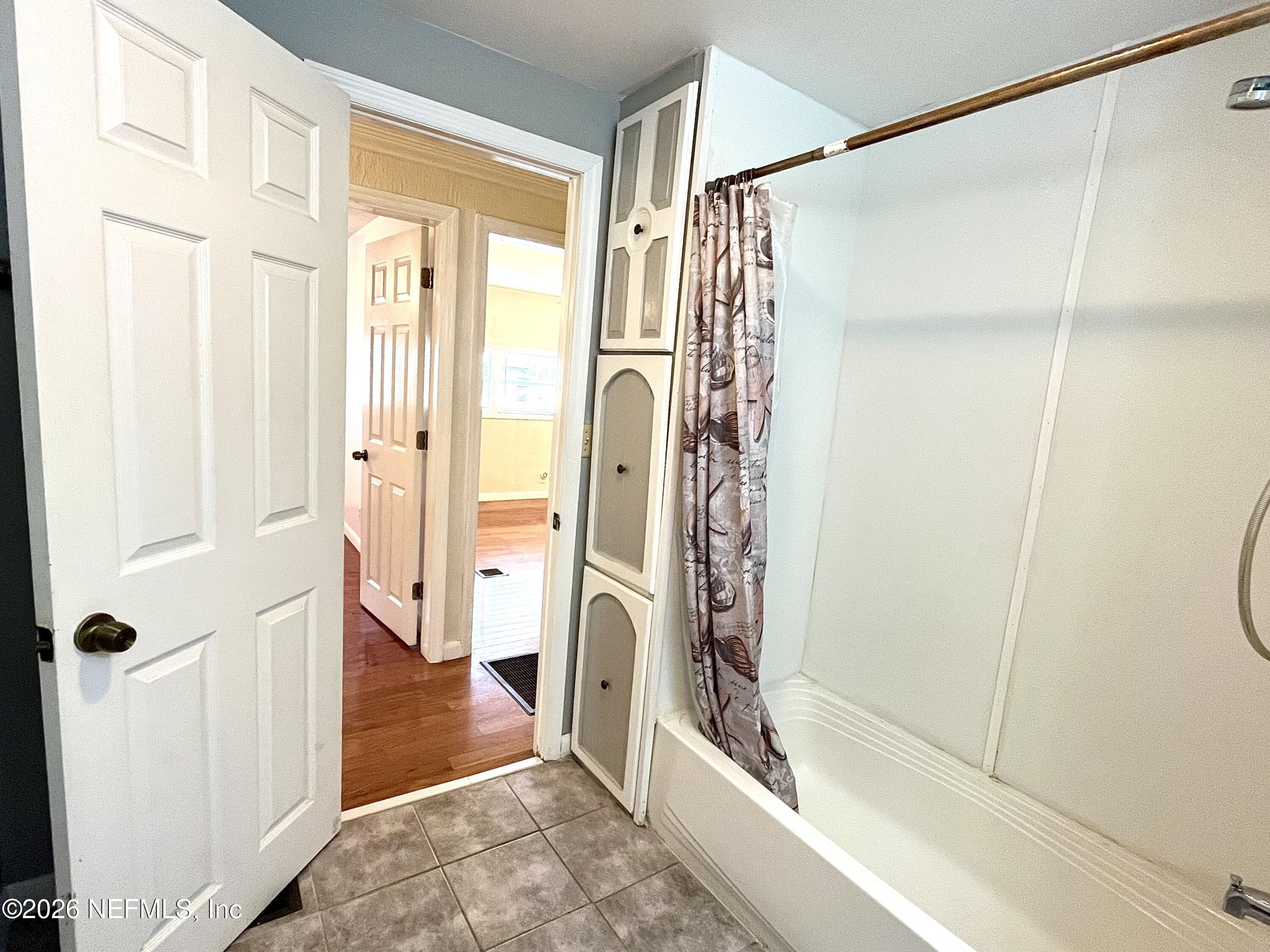 145 Magnolia Trail Satsuma, FL 32189 - Photo 16 of 20 a bathroom with a glass door shower and a sink