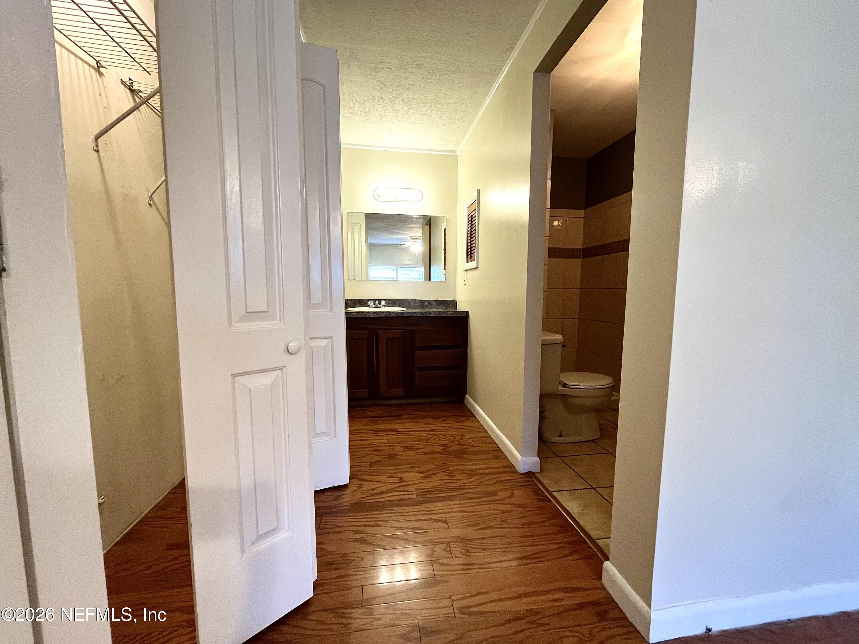 145 Magnolia Trail Satsuma, FL 32189 - Photo 19 of 20 a view of a hallway with wooden floor