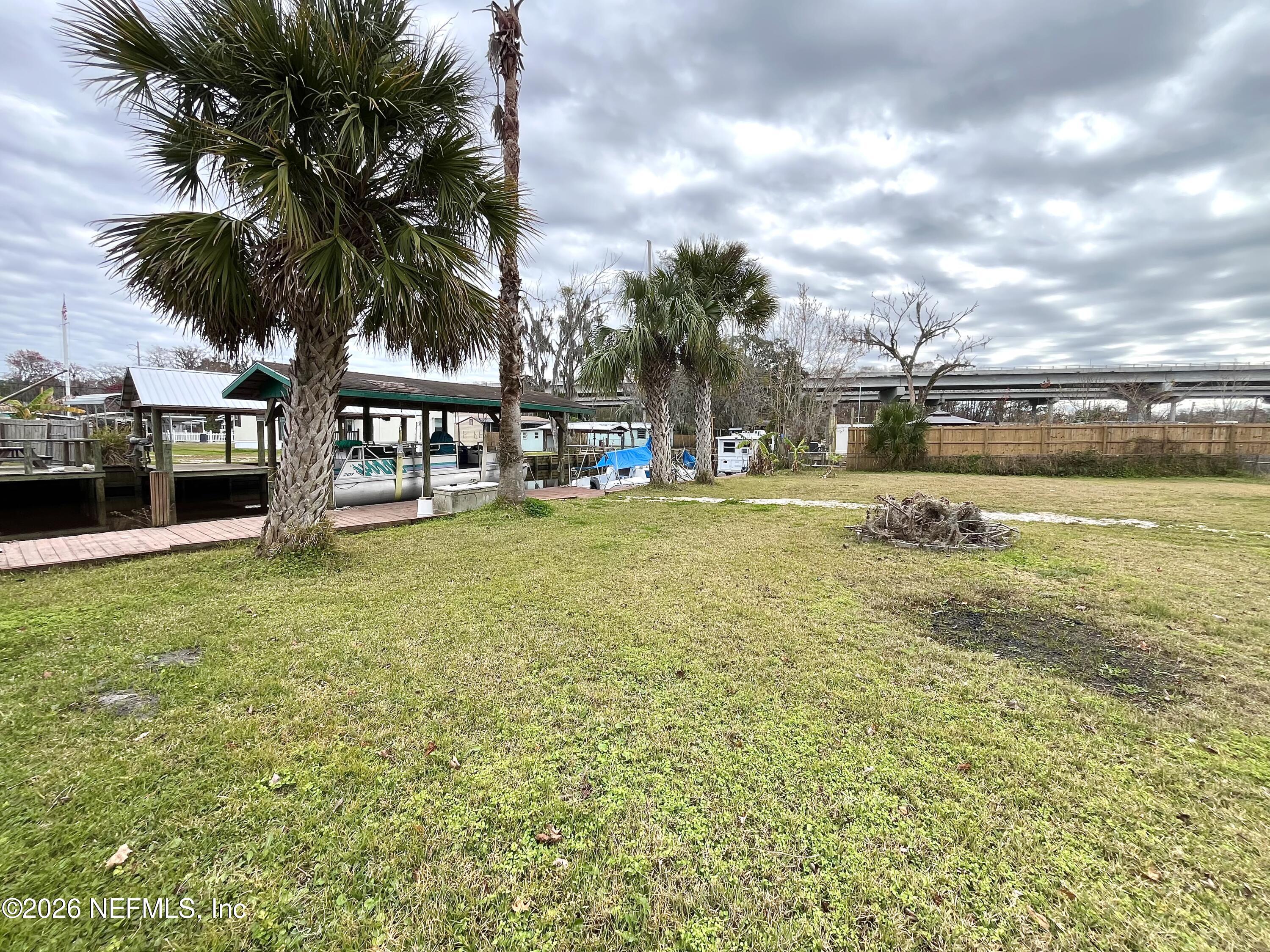 145 Magnolia Trail Satsuma, FL 32189 - Photo 5 of 20 a swimming pool with outdoor seating and yard