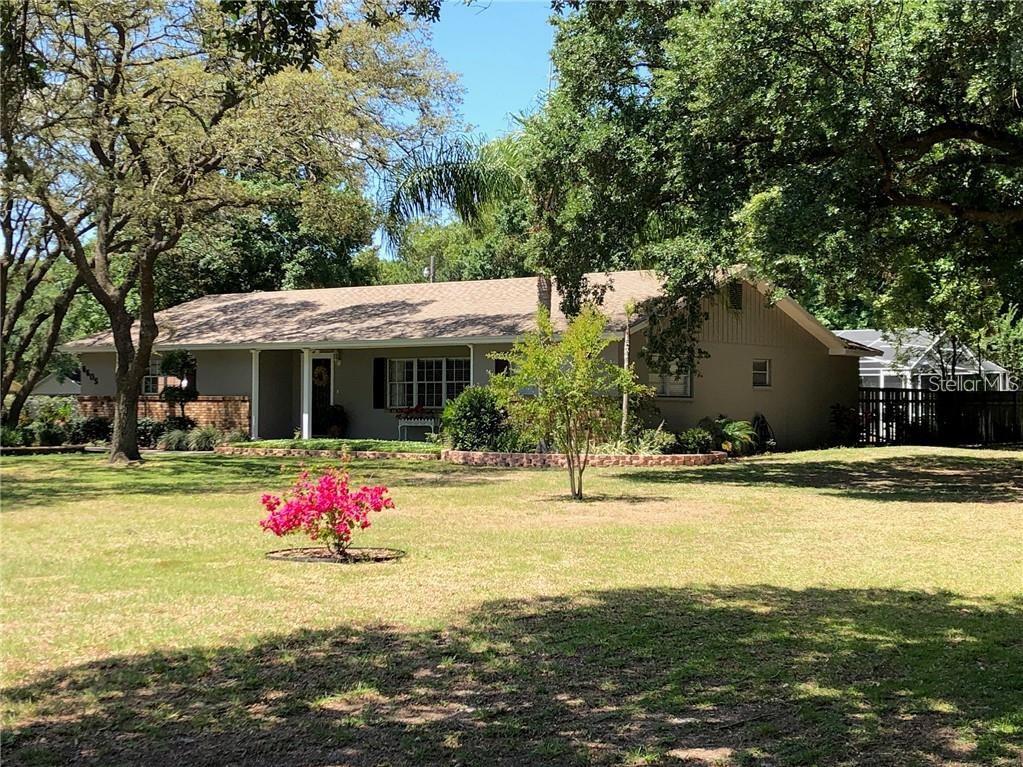 6605 Lunn Road Lakeland, FL 33811 - Photo 1 of 1 a front view of house with yard and trees