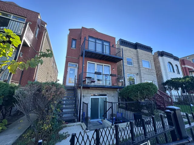 a view of multiple houses with a yard