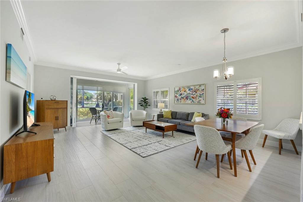 6240 Reserve Circle, Unit 802 Naples, FL 34119 - Photo 12 of 47 Large dining and living area. Beautiful "wood look" tile floors throughout the home.