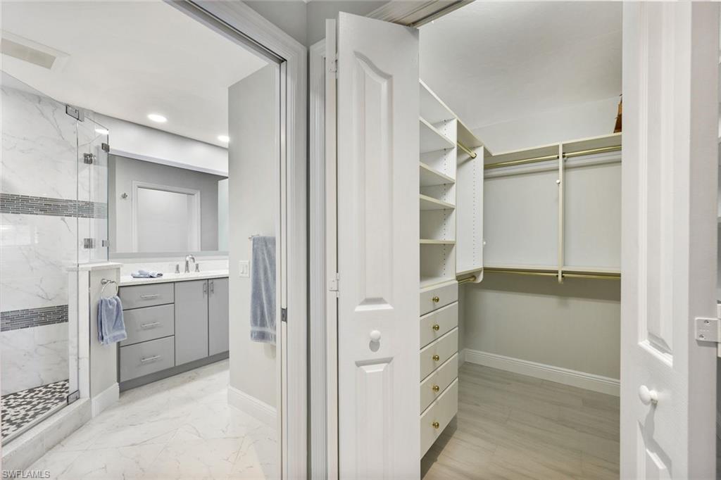6240 Reserve Circle, Unit 802 Naples, FL 34119 - Photo 25 of 47 One walk-in closet & one large reach-in closet in Primary suite.