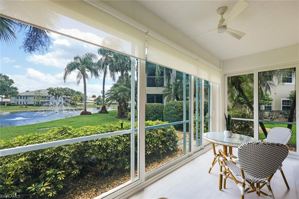6240 Reserve Circle, Unit 802 Naples, FL 34119 - Photo 3 of 47 Screened & glassed-in lanai offering extra living space and beautiful views.