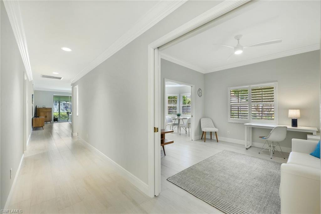 6240 Reserve Circle, Unit 802 Naples, FL 34119 - Photo 9 of 47 Den with pocket doors for privacy.