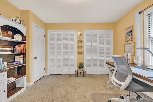 a view of room with workspace and toys