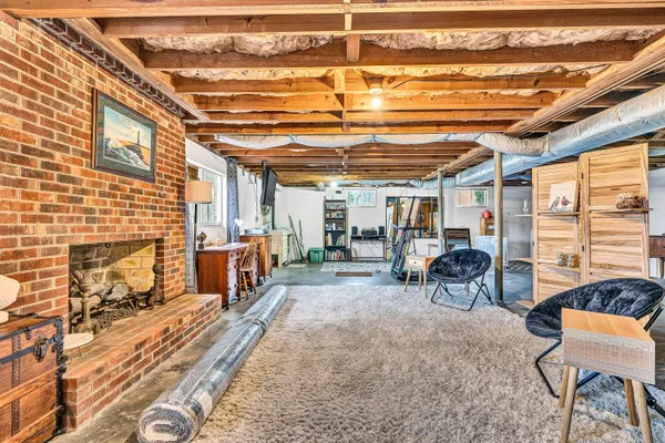 a view of a patio with table and chairs