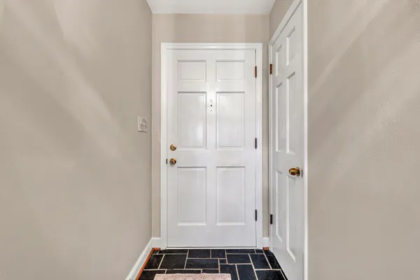 a view of bathroom with white walls