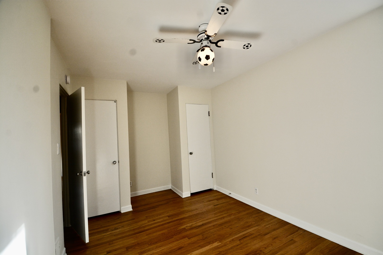 609 North Loomis Street Naperville, IL 60563 - Photo 5 of 13 a view of an empty room with wooden floor