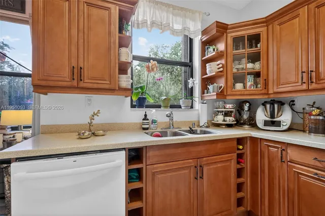 a kitchen with a sink and a stove