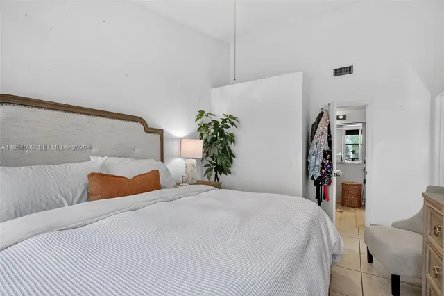 a bathroom with a sink mirror and a shower