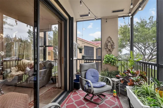 a view of a balcony with chairs