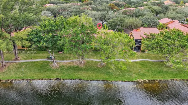 a view of a garden with a building in the background
