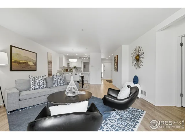 a living room with furniture a rug and a couch