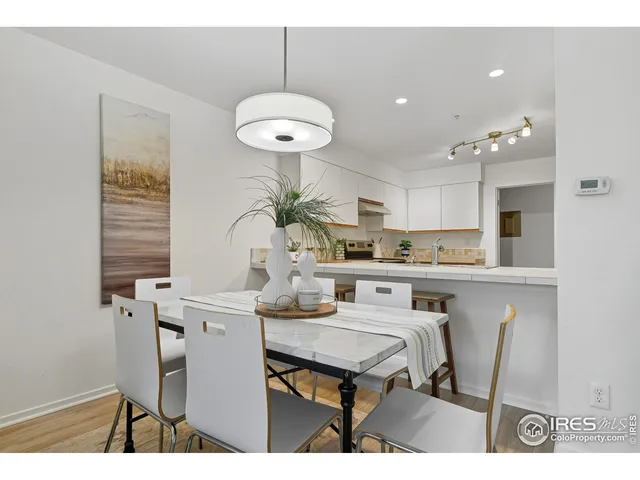 a kitchen with a table and chairs in it