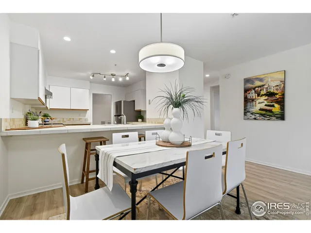 a kitchen with a table and chairs in it