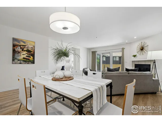 a view of a dining room with furniture and a fireplace