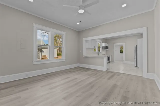 a view of an empty room with a window