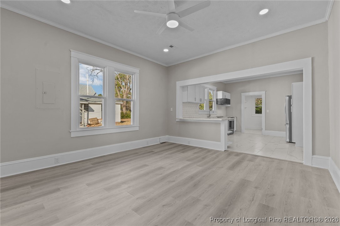 220 Beaman Street Clinton, NC 28328 - Photo 12 of 32 a view of an empty room with a window